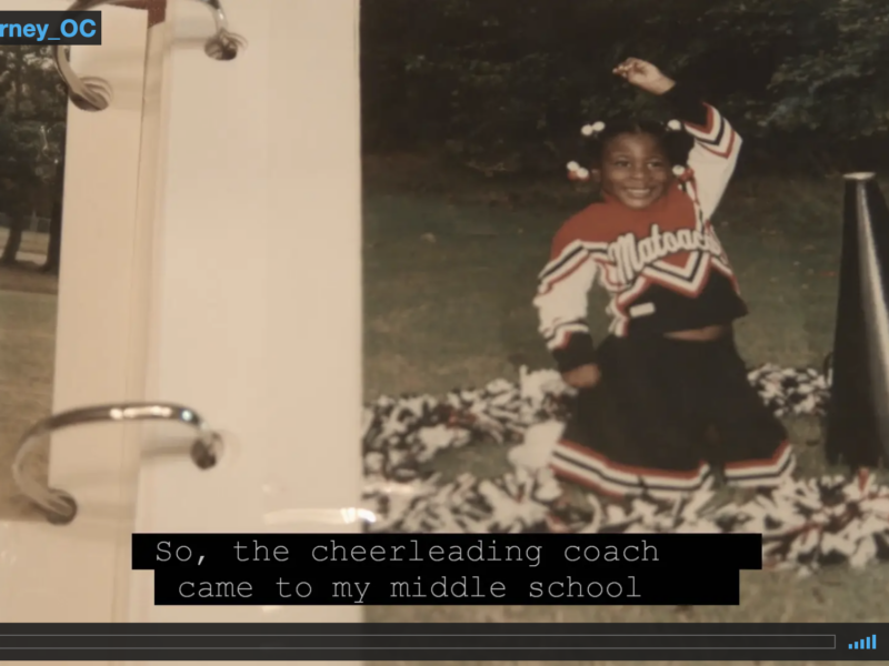 Screen capture from Taylor's Journey video featuring a photo of young Taylor in a cheerleading outfit, smiling with one arm in the air.