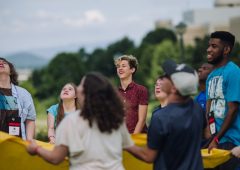 a group of eight youth play a game at an I'm Determined Event