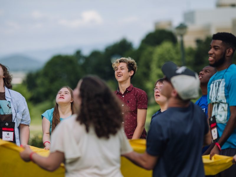 a group of eight youth play a game at an I'm Determined Event