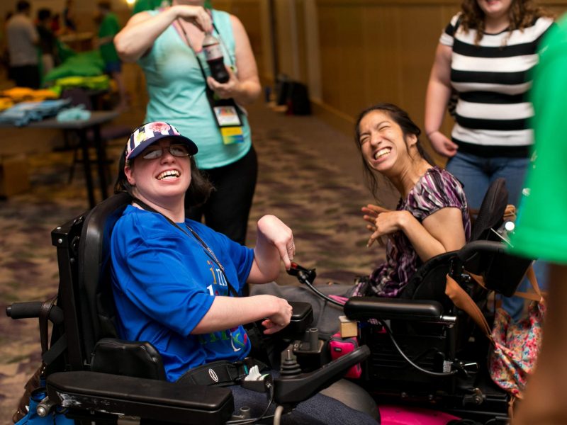 two youth smile at the camera at an I'm Determined event