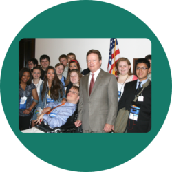 Group of youth leaders at the state capitol meeting with a member of the legislature.